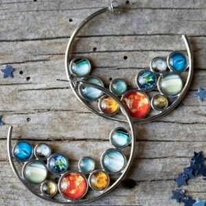 NWT! Silver Tone Hoop Pierced Earrings Cradling a Mass of Planets!